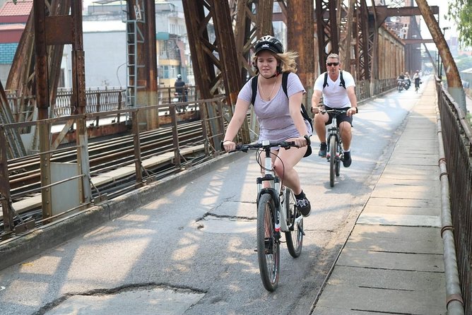 Bicycle Tour Full Day Explore Red River Delta & Rural Villages - Long Bien Bridge: city alleyways to river-crossing perspective