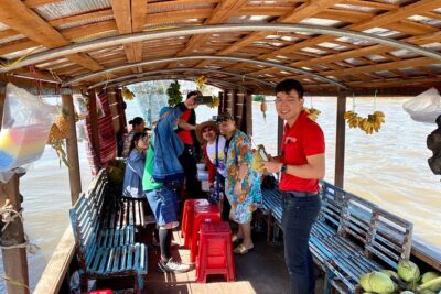 Cai Be Mekong Delta Tour: Cooking Class, Cycling & Craft Villages - Cai Be craft villages: coconut candy, rice popcorn, and fruit with music