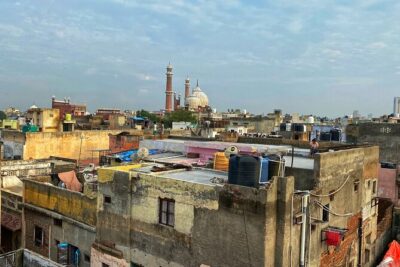 Half-Day Premium Classic Old Delhi Cycling Tour - Unity in Diversity - The Bike Tribe setup: helmet, safety jacket, and a geared Trek