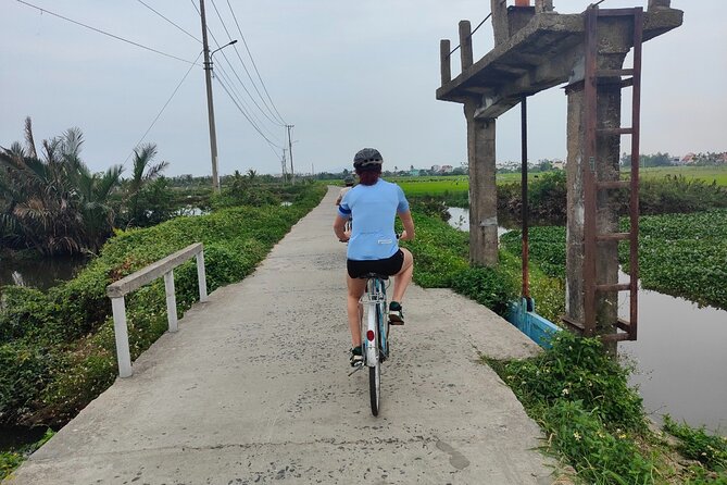 Hoi An Half-Day Bicycle Tour: Visit Herb Village, Row Basket Boat - Tra Que herb village: watching and helping with real farm work