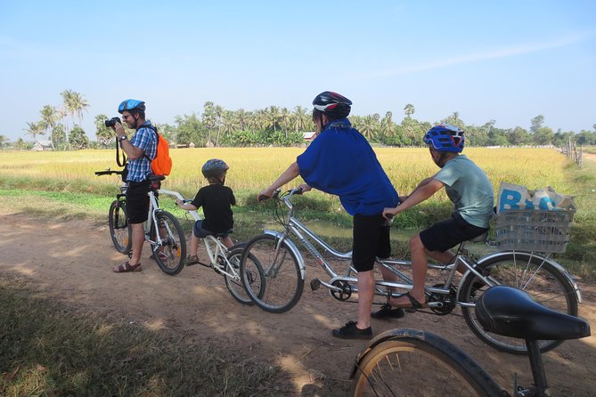 Short Cycling at Countryside - Angkor Cycling Tour setup: TREK bike, helmet, and cooling drinks