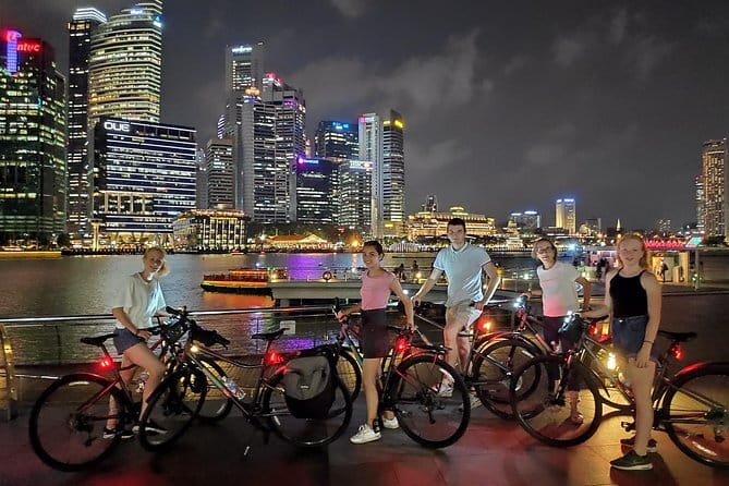 Singapore Private Night Cycling with Dinner - Marina Bay Sands area: Shoppes views, Waterfront Promenade, and Merlion Park