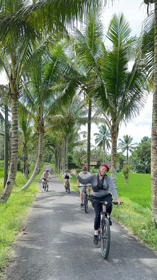 Ubud: Cycling Tour Local Villages, Temple, and Rice Field - Temple stop: calm stone carvings, sacred grounds, and a separate entrance